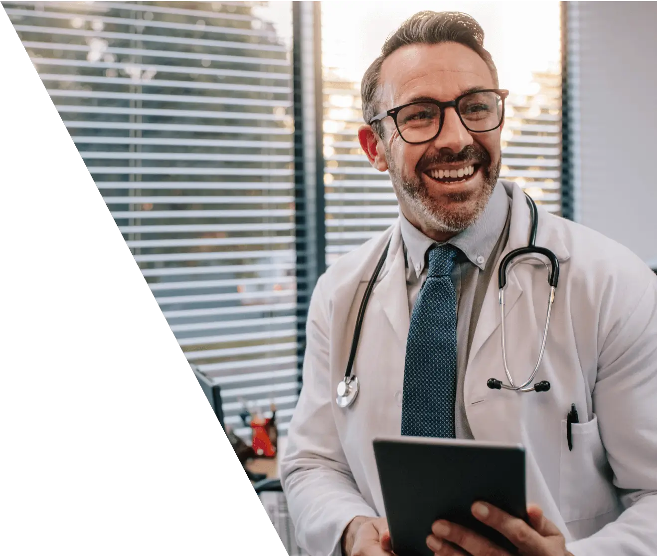 Doctor with digital tablet in his office